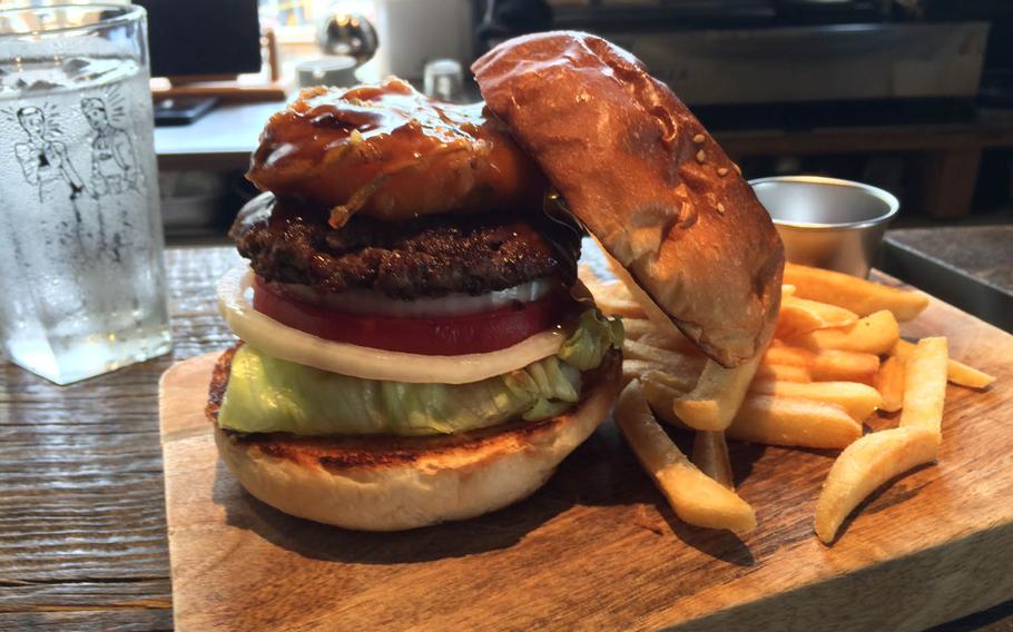 The McLean Tempura Burger from McLean Old Burger Stand in Tokyo was perfectly presented on a wooden cutting board that doubled as a plate. However, the flavors didn't mesh well. 