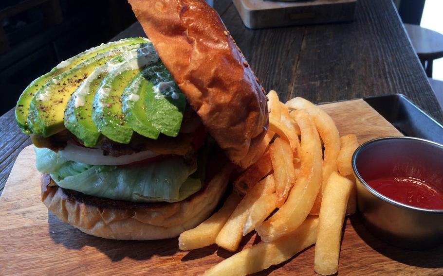 The Avocado Cheese Burger from McLean Old Burger Stand includes a big hunk of juicy, grilled meat and generous portions of avocado stacked between two delicious caramelized buns.