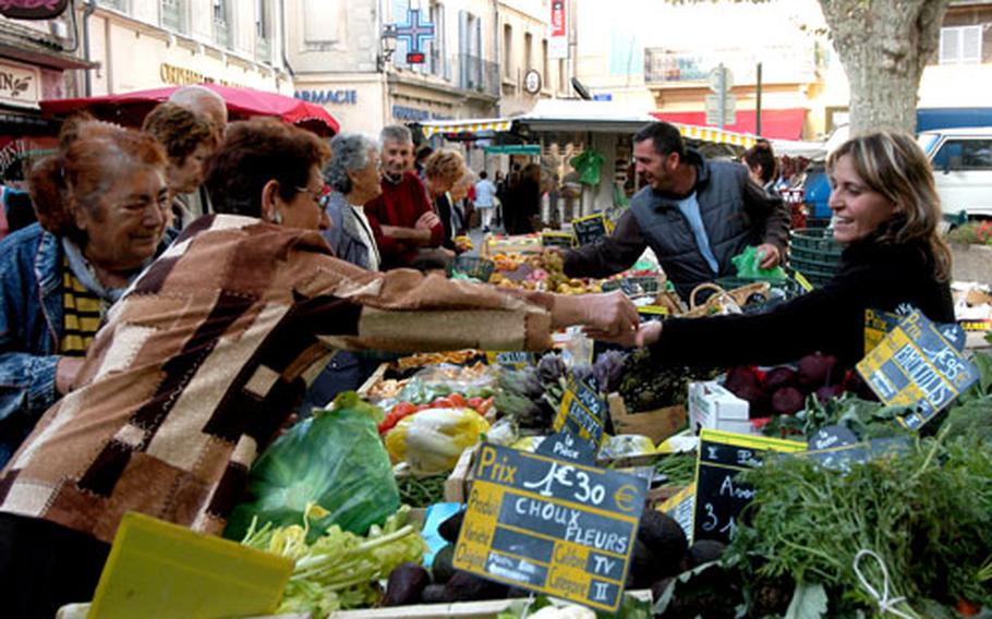 Tourists and locals alike enjoy the famous Provençal market on Wednesday mornings, where vendors sell everything from olive oil and “herbes de Provence” to soaps and fabrics.