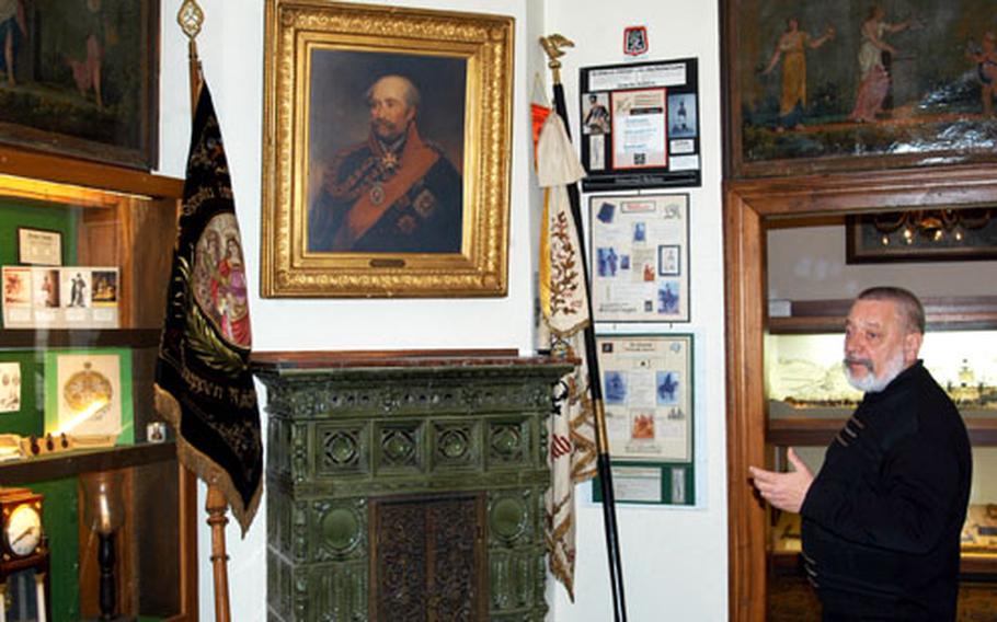 Custodian Herbert Rest of the Blücher museum in Kaub, Germany, explains a part of the collection of memorabilia of Field Marshal Gebhard Leberecht von Blücher.