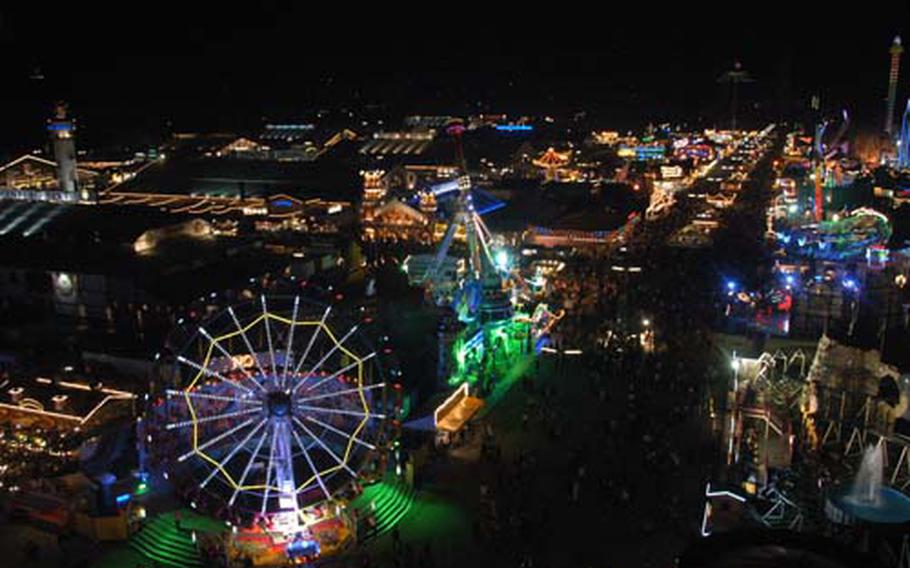 The festival grounds sparkle at night in this view from atop the Ferris wheel. More than 6 million people are expected to take part in the festival by closing time Sunday.