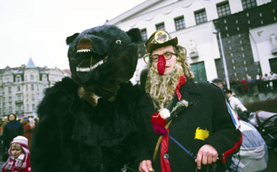 The bear and its trainer are among the traditional characters from the village of Studnice, Czech Republic, and have been part of traditional carnival celebrations there for 200 to 300 years. The bear costume is said to be made of real fur.