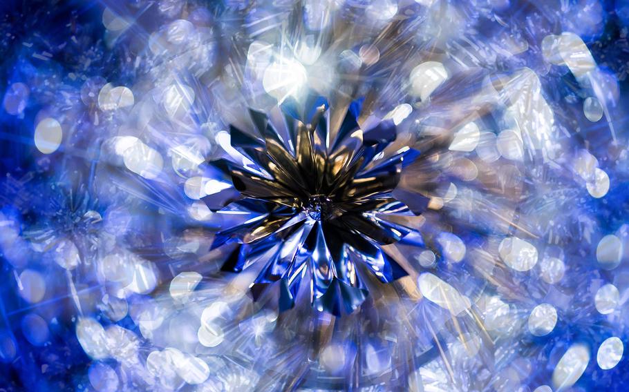 View of the Snowy Air Chandelier from directly underneath along the Roppongi Hills West Walk. The chandelier is made of bird feathers and foil and was designed by reknowned designer Kosei Komatsu.