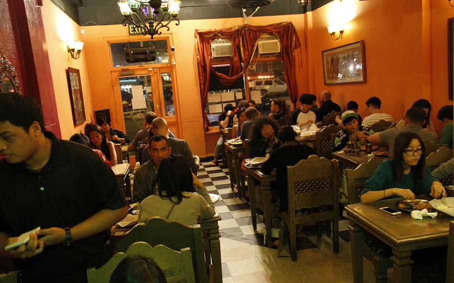 Diners in the compact Cafe Maharani on a recent Friday evening. 