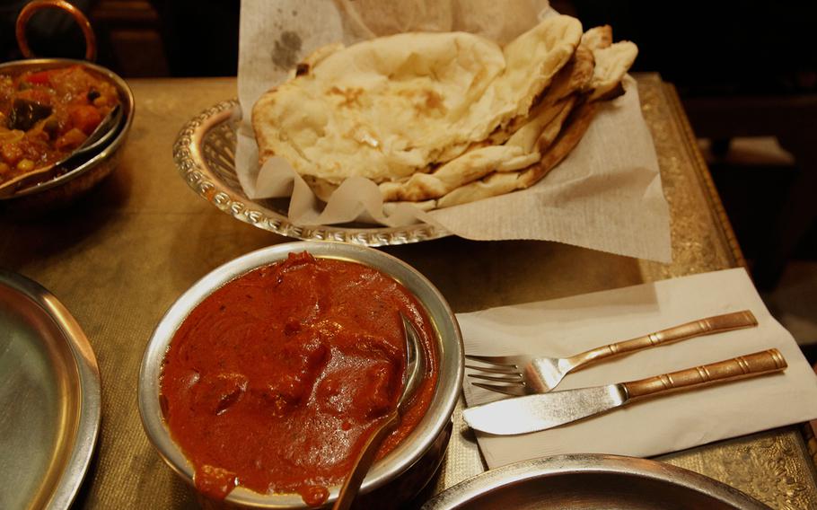 The perfect pair: hot slabs of naan and lamb roghan josh in a rich red sauce.