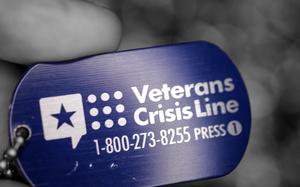 A photo illustration with the telephone number of the Veteran's Crisis Line. (U.S. Air Force photo illustration by Zachary Hada)