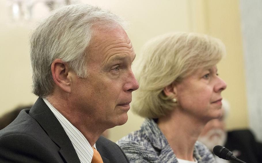 Sens. Ron Johnson, R-Wis. and Tammy Baldwin, D-Wis. listen during a discussion at a Senate Veterans’ Affairs Committee hearing in 2015.